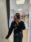 Pull col V poche devant noir